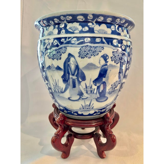 Chinoiserie Circa 1900 Chinese Blue & White Prunus Figural Porcelain Jardinière With Wood Stand For Sale - Image 3 of 12