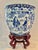Chinoiserie Circa 1900 Chinese Blue & White Prunus Figural Porcelain Jardinière With Wood Stand For Sale - Image 3 of 12