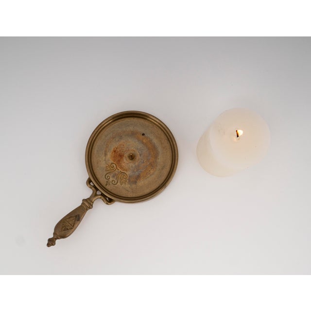 This exquisite object blends rustic charm with elegant materiality, crafted as a heavy table candlestick from the 1960s in...