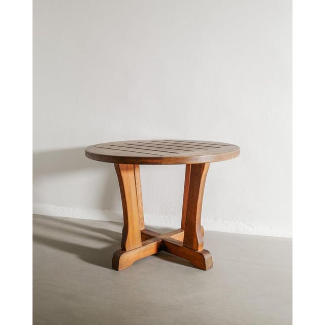 A very rare Swedish modern round console center dining table in brown stained pine wood from the "Berga" series by David...