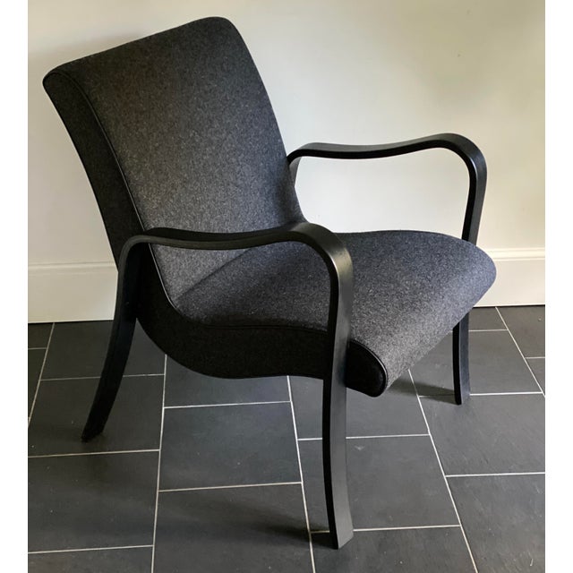 Newly Upholstered in dark grey will with black leather piping Thonet Lounge Arm Chair. Recently ebonized wood.