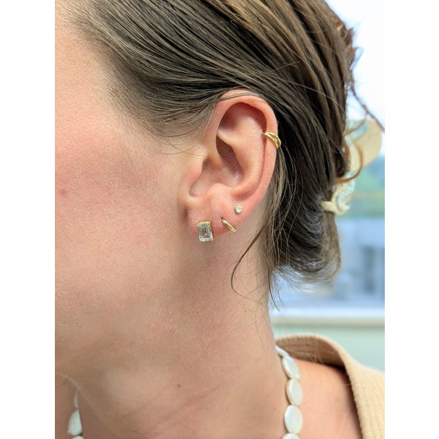 Sleek and sophisticated, these solitaire studs showcase Brazilian aquamarine in an elegant emerald cut. Set in solid 14k...