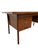 A handsome Mid-Century Danish Modern teak executive’s desk, circa 1960s, recently refinished to restore the richness and...