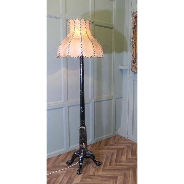 A Black Chinoiserie Lacquer Decorated Standard Lamp This is a good quality Chinoiserie lamp it stands on a sturdy 4 footed...