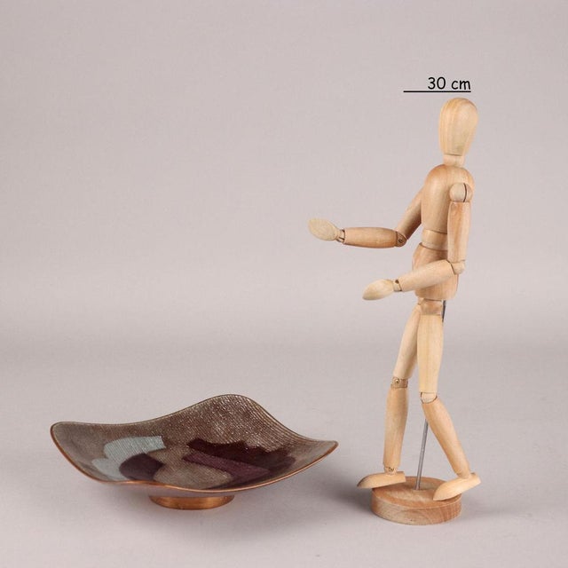 Thick copper bowl decorated with polychrome enamels. Under the base engraved trademark. Studio del Campo, an artisan...