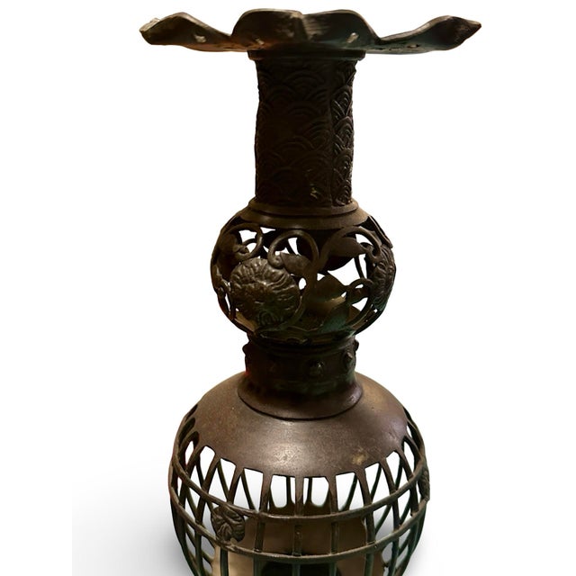 Beautiful Japanese bronze candle holder. This piece dates back to 19th or early 20th century. There is a lotus motif from...