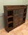 Arts and Crafts Glazed Liberty Bookcase with Open Shelving This piece is being offered from a dispersal sale of Arts and...