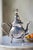 MOROCCAN SILVER TEAPOT Era: Mid-20th Century Origin: Morocco Material: Silver-plated Metal OVERVIEW: An ornate Moroccan...