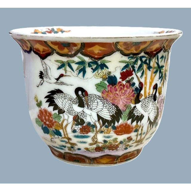 Vintage chinoiserie planter with a bold design of black and gold cranes and flowers. A beautiful cachepot, hand painted...