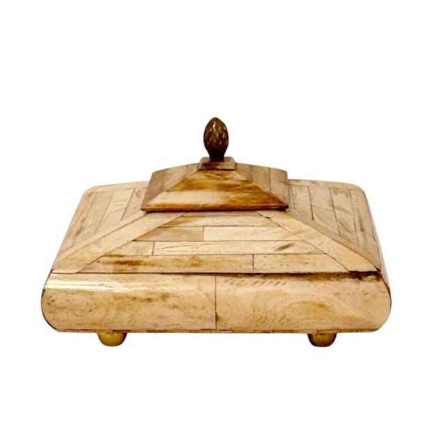 A distinctive decorative box in the style of Maitland Smith, dating to the 1970s, featuring bone inlay construction with a...
