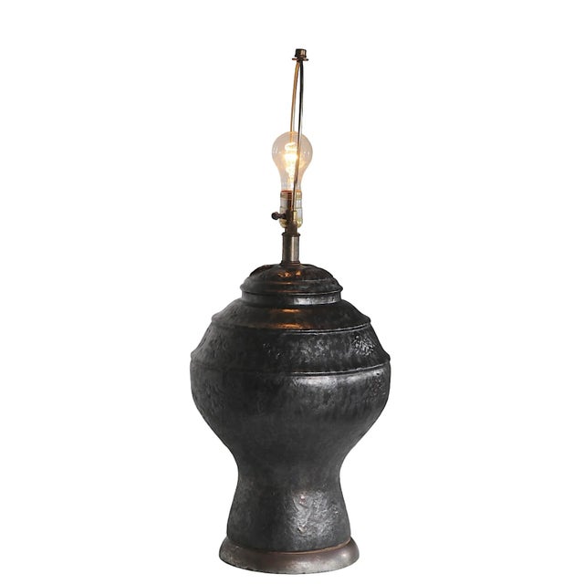 Brutalist Style ceramic table lamp base, having a textured surface of tonal black and bronze glaze, on a raw finish steel...