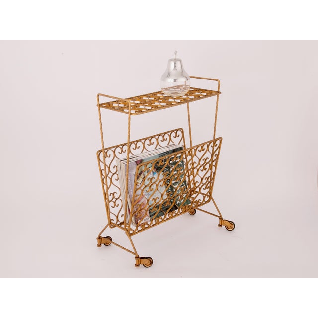 Mid century Italian magazine rack from the 1970s, made from gold colored Iron. Practical as a magazine or blanket holder,...