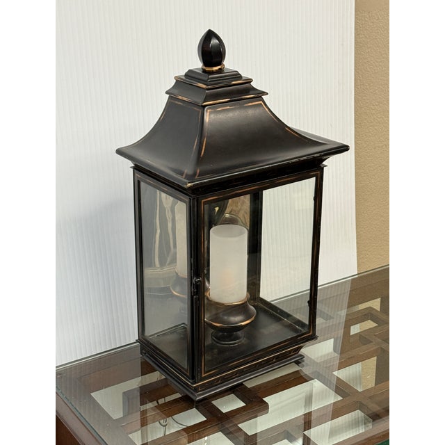 Design Plus Gallery presents a Large Burnished Metal Pagoda Wall Sconce. The sconce has the ability to sit upright on a...