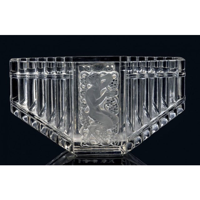 "pan" vase. A pressed, colorless, molded glass piece, with a glossy and satin-matte finish, in the shape of a panpipe with...