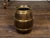 A rustic English turn of the century oak barrel from the early 20th century, with brass braces, and ring handles. Created...