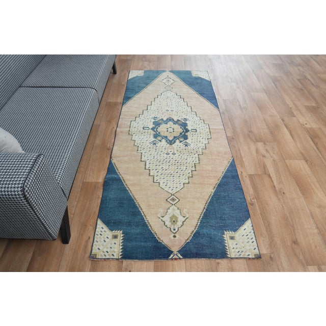 This vintage hand-knotted area rug is a semi-antique vintage area rug. The '70s Eastern region of Anatolian's unique rug...