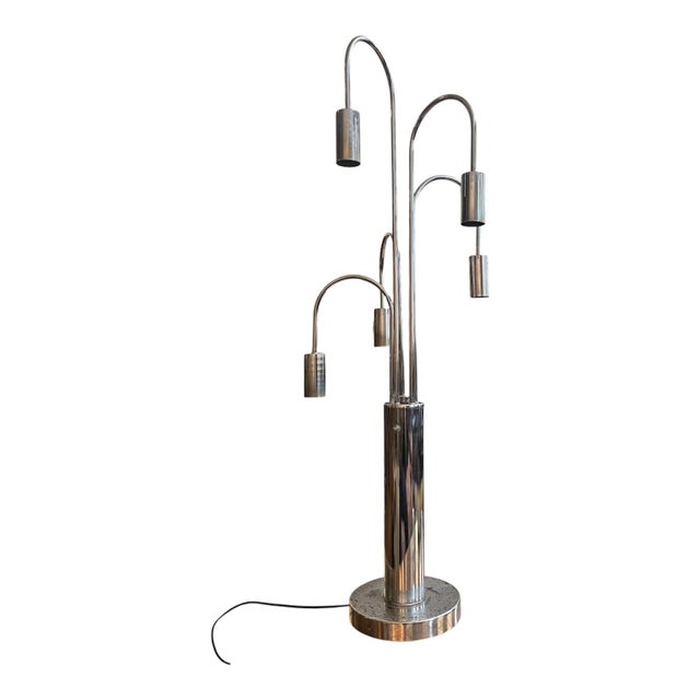 A wonderful and authentic 1970s Cascading Chrome Waterfall Table Lamp, attributed to Sonneman. This striking oversized...