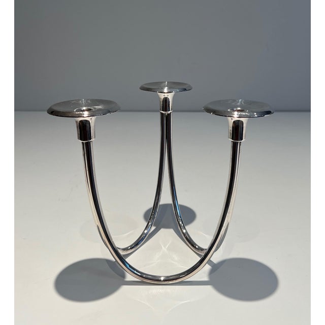 This beautiful 3-candle designer candlestick is made of silver-plated metal. It is a French piece. Circa 1970
