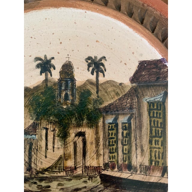 A stunning Grand Tour style hand painted terracotta wall plate featuring a mediterranean scene Circa mid-20th century...
