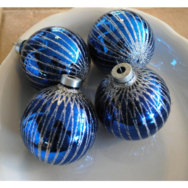 These four blue mica decorated mercury glass ornaments will brighten up any holiday decor. They have a vertical weave of...