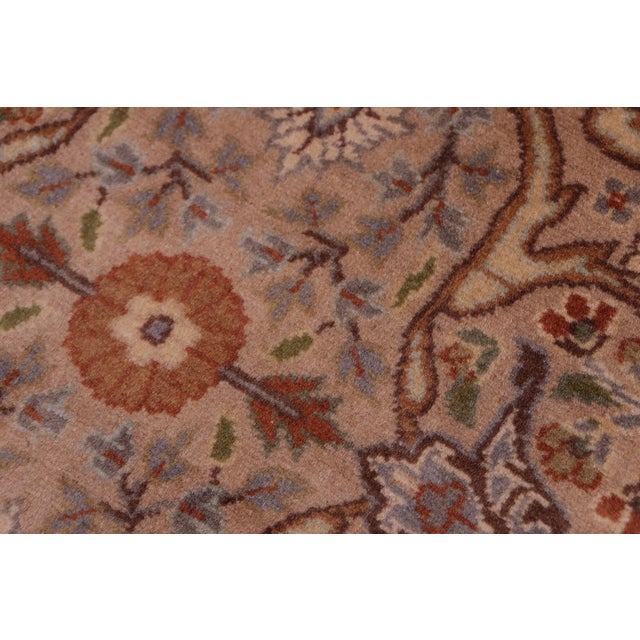 Designed with mesmerizing intricacy and gorgeous color palette, this hand-knotted masterpiece demonstrates the beauty and...