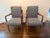 Elegant pair of vintage mid-century modern lounge chairs featuring beautifully sculpted walnut frames, tapered legs, and...