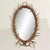 This oval mirror doesn’t just borrow from the language of the wilderness, it speaks it fluently. Its oak frame is entirely...