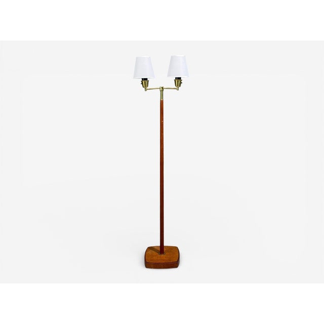 Swedish Mid-Century Modern, Floor Lamp, Teak, Brass, Fabric, Sweden, 1960s A double light floor lamp designed and produced...