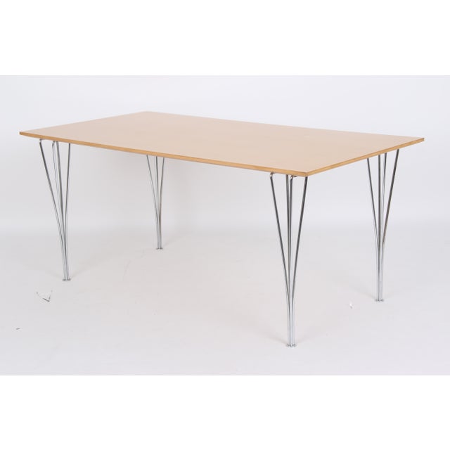 Beautiful rectangular dining table from Denmark, manufactured by Fritz Hansen. This table series was designed in 1968 by...