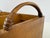 A generously proportioned vintage Indonesian storage caddy combining warm honey-toned wood with natural woven-fiber panels...