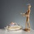 Porcelain inkwell with gold and polychrome decoration. The lid features a sculpture of a sleeping child. This piece is...