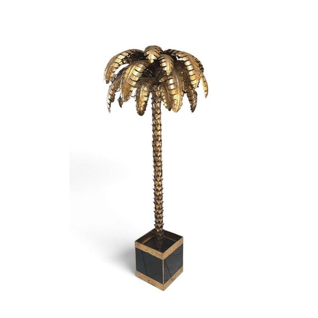 An exceptional pair of monumental French palm tree sculptures, crafted in forged gilt metal during the 1970s and executed...