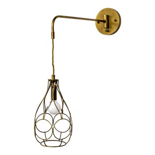 Contemporary Long Arm Hanging Brass Cage Sconce With Circle Motif For Sale