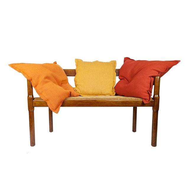 Two-seater walnut bench with a removable seat upholstered in rope. The bench is part of the "Carimate" collection,...