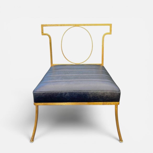 A pair of exceptional quality custom chairs after a design by William "Billy" Haines. Made of hand-forged iron, gold leaf,...