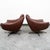 Pair of brown leather swivel chairs by unknown Danish designer. Original soft leather in brown set on a swivelling metal...