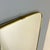A very beautiful wall mirror with a black-striped brass frame and the typical trapezoidal shape of the 1960s. It is...