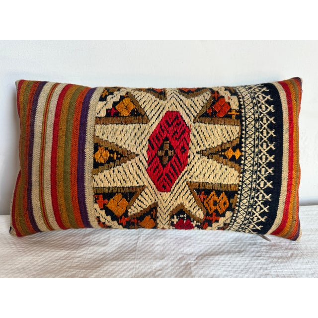 Bold and colorful, this 1920 Suzani pillow brings a pop of bohemian elegance to any space. Featuring traditional geometric...