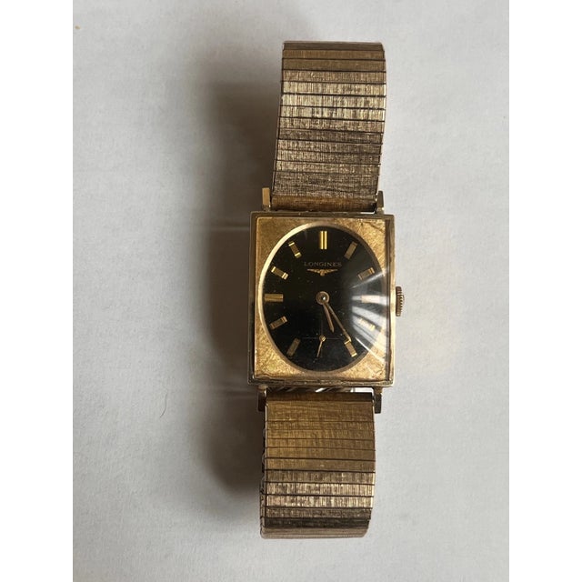 Vintage Longines-Wittnauer manual-wind wristwatch featuring a textured rectangular 10K gold-filled case (ref. 1137-370)...