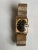Vintage Longines-Wittnauer manual-wind wristwatch featuring a textured rectangular 10K gold-filled case (ref. 1137-370)...