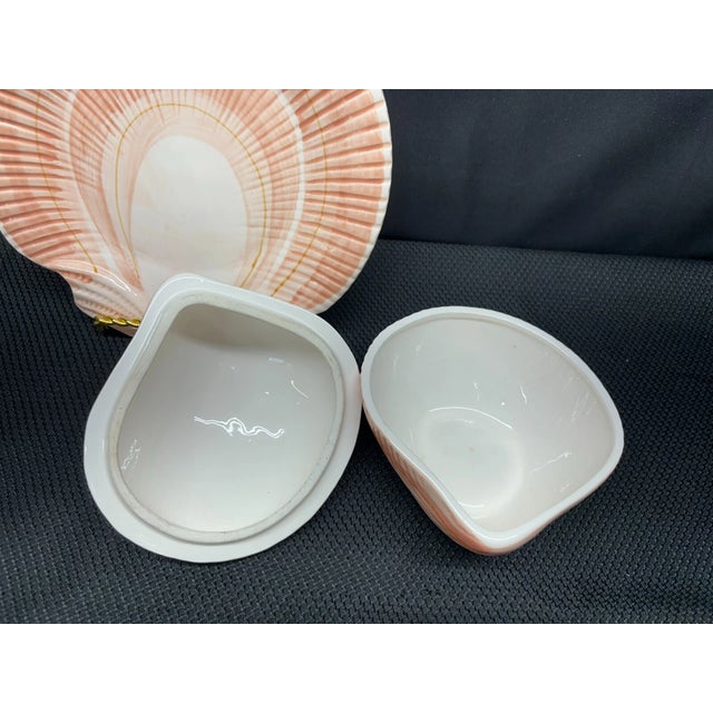 Bring elegant coastal charm to your collection with this **Vintage Fitz & Floyd “Coquille” shell-shaped plate and matching...