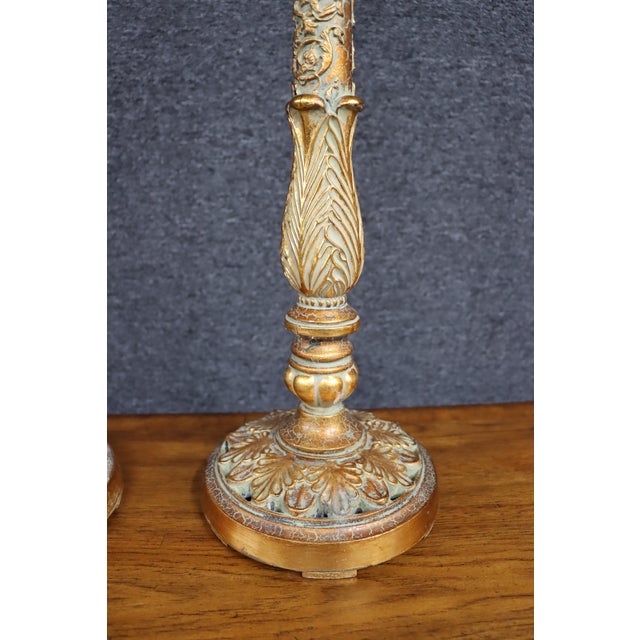 Elegant pair of Italian neoclassical table lamps featuring tapered column forms with richly molded acanthus leaves,...