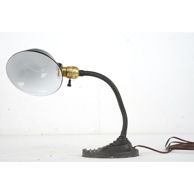 1930s Art Deco style gooseneck desk lamp made of steel with a black and antique brass finish. Great condition with some...