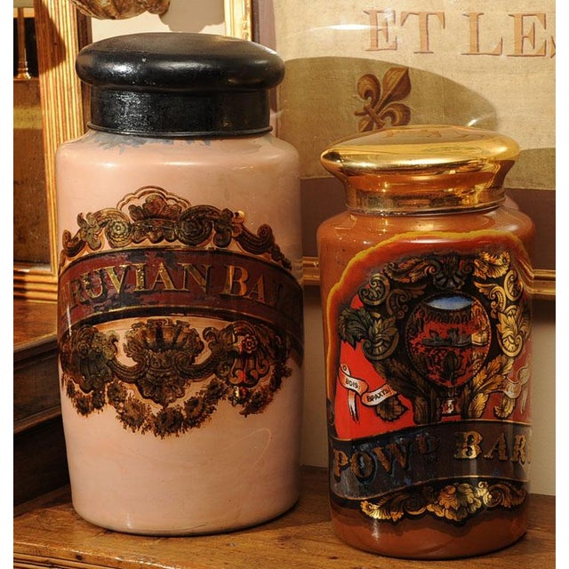 Reverse painted glass pharmacy jars, English circa 1830.