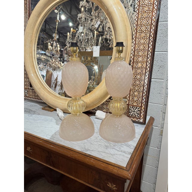 These Murano pink and gold glass lamps are perfect for adding a touch of elegance to their home. The beautiful and stylish...