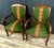 Pair of Empire Restoration period mahogany armchairs with petit point upholstery. Scroll armrests. Saber legs. Circa...