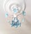Rare 1980s vintage Murano glass chandelier in stunning blue with white metal frame. This small Italian floral ceiling...