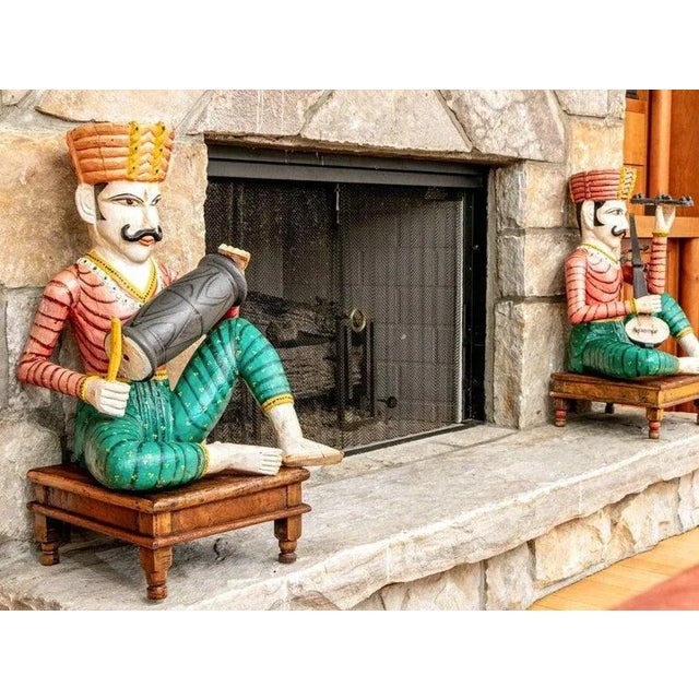 A pair of large rare antique hand carved and painted Rajasthani folk musicians, dating to the late 19th / early 20th...