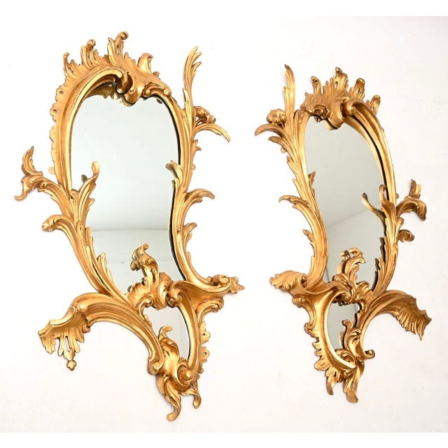 An exceptional pair of antique French carved gilt wood mirrors. We would date them from around the 1840-1860 period,...