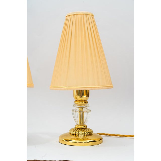 2 Bakalowits Table lamps with fabric shades vienna around 1950s. Brass polished and stove enameled. The fabric shades are...